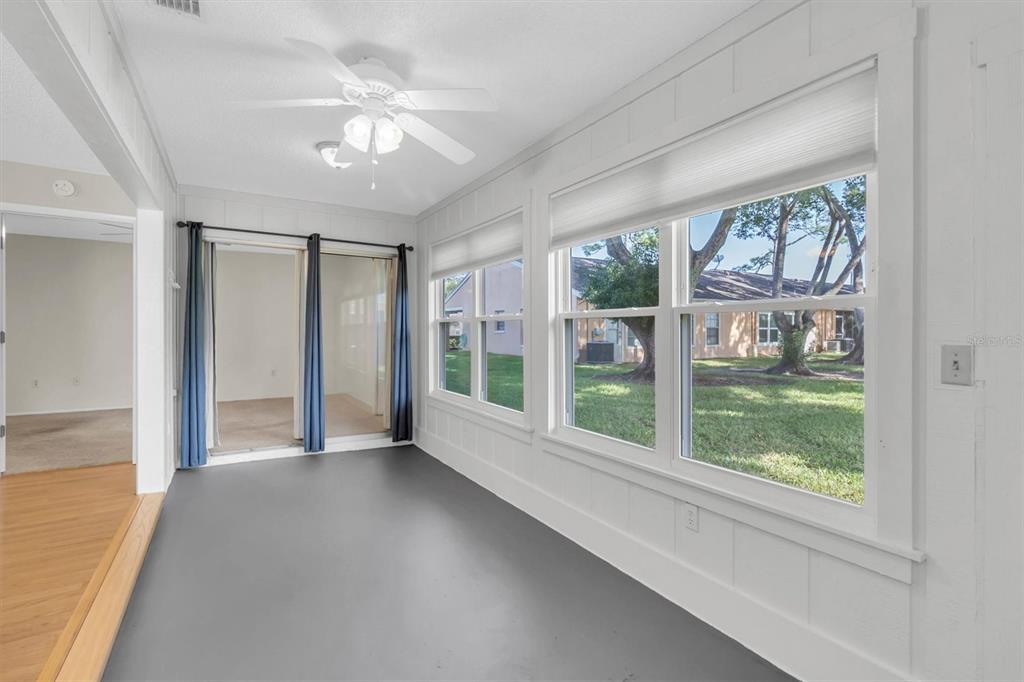 4814 Grist Mill Circle New Port Richey, FL 34655 - Photo 16 of 63 a view of an empty room with a window