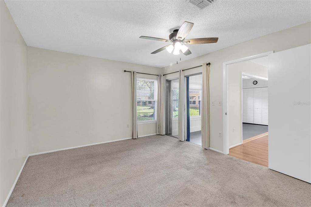 4814 Grist Mill Circle New Port Richey, FL 34655 - Photo 17 of 63 a view of an empty room with a window