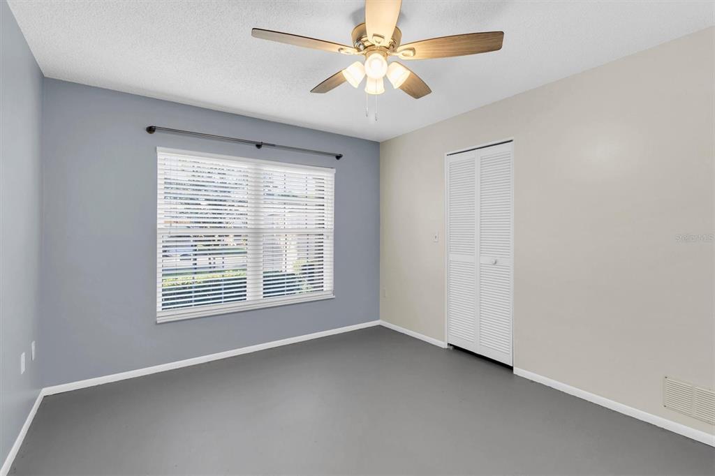 4814 Grist Mill Circle New Port Richey, FL 34655 - Photo 22 of 63 a view of an empty room with a window
