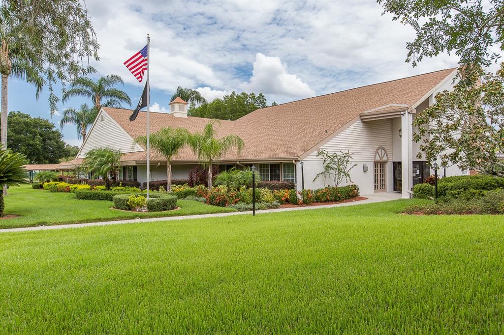 4814 Grist Mill Circle New Port Richey, FL 34655 - Photo 38 of 63 a front view of house with yard and car parked
