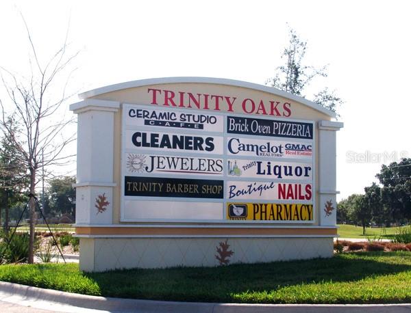 4814 Grist Mill Circle New Port Richey, FL 34655 - Photo 52 of 63 a sign that is on the side of a building