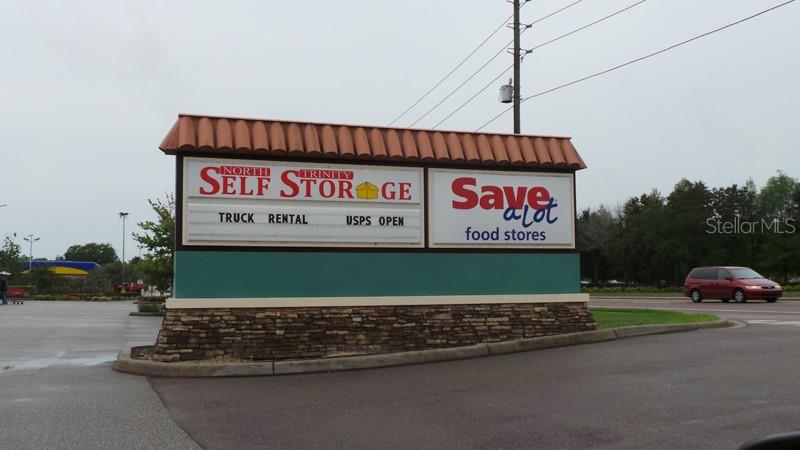 4814 Grist Mill Circle New Port Richey, FL 34655 - Photo 55 of 63 a view of a street with shops