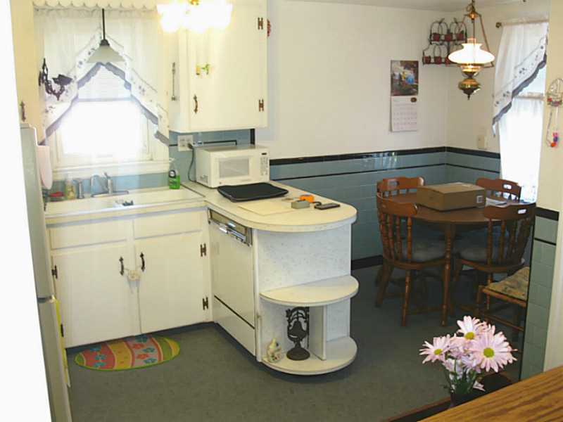 Kitchen. Eat in kitchen with separate dining area, could use a few updates, hardwoods under carpet!!