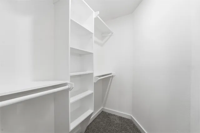a view of an empty walk in closet