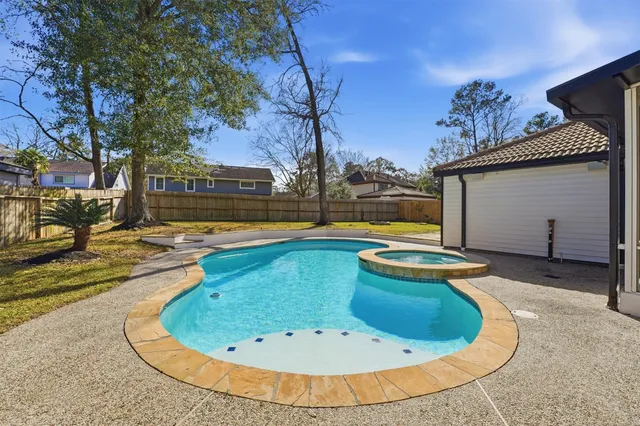 a view of a swimming pool with a lounge chairs