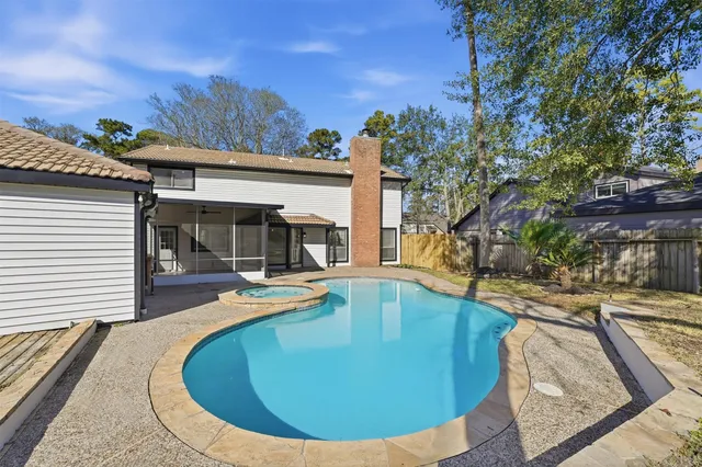 a view of a swimming pool with an outdoor seating