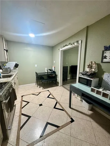 a kitchen with a table and chairs in it