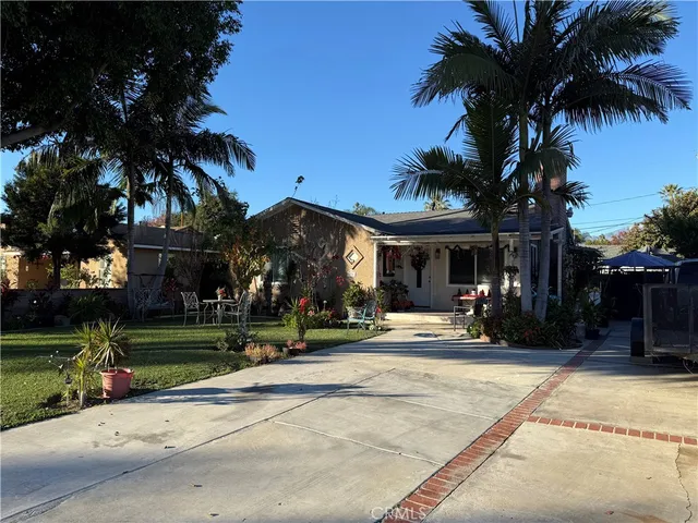 front view of a brick building with a yard