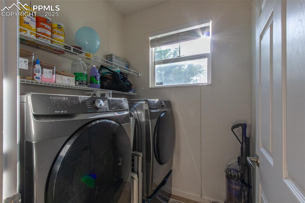 7544 Jaoul Point Peyton, CO 80831 - Photo 13 of 37 a utility room with dryer and washer