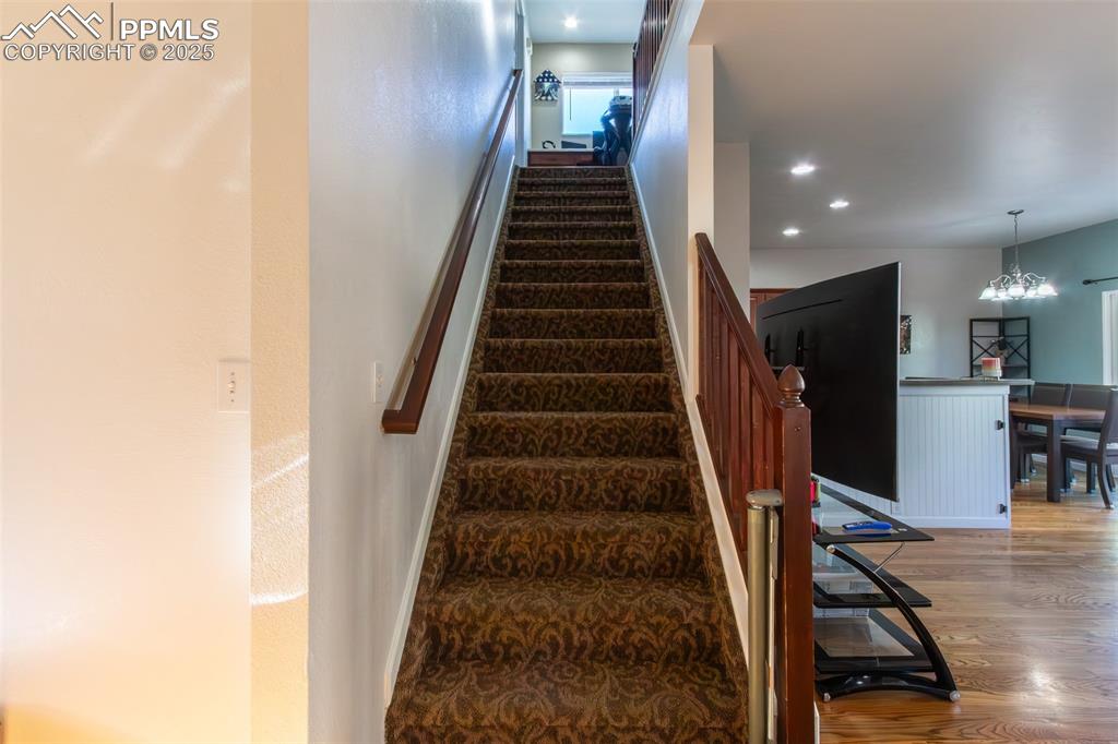 7544 Jaoul Point Peyton, CO 80831 - Photo 14 of 37 a view of entryway and hall with wooden floor