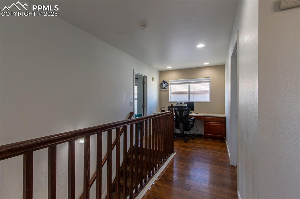 7544 Jaoul Point Peyton, CO 80831 - Photo 26 of 37 a view of a room with wooden floor and furniture