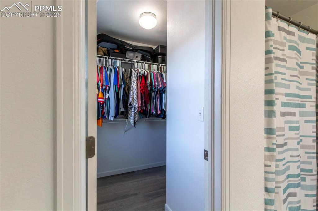 7544 Jaoul Point Peyton, CO 80831 - Photo 31 of 37 a view of walk in closet with clothes