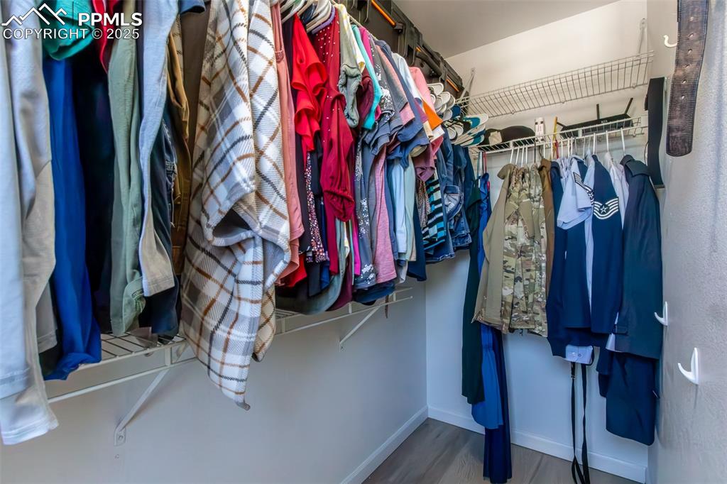 7544 Jaoul Point Peyton, CO 80831 - Photo 32 of 37 a view of walk in closet with clothes