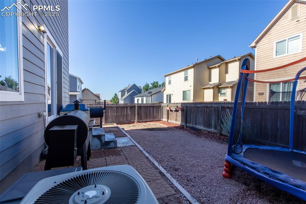 7544 Jaoul Point Peyton, CO 80831 - Photo 33 of 37 a view of backyard with deck and outdoor seating