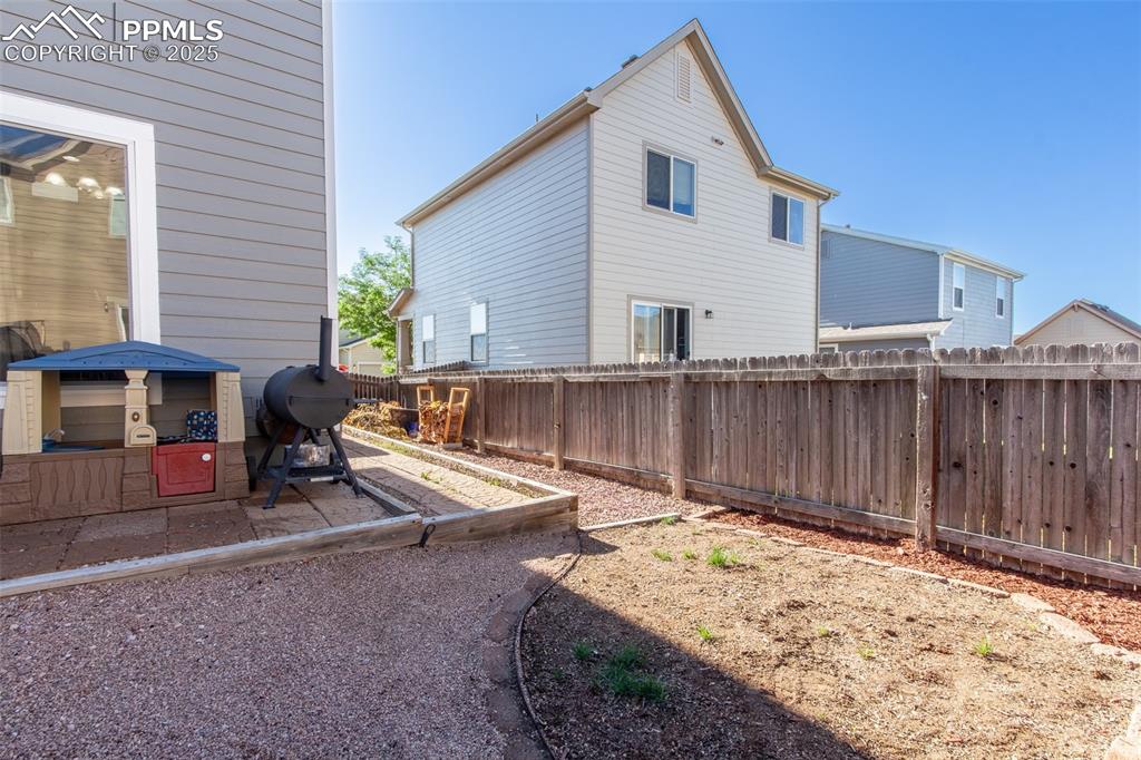 7544 Jaoul Point Peyton, CO 80831 - Photo 35 of 37 a view of a house with backyard and sitting area