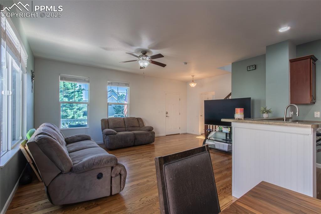 7544 Jaoul Point Peyton, CO 80831 - Photo 7 of 37 a living room with furniture and a flat screen tv