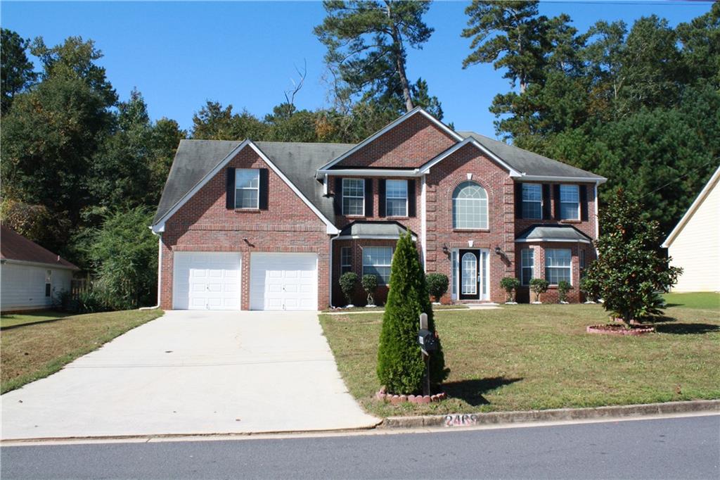 2469 Marsh Rabbit Bend Decatur, GA 30035 - Photo 1 of 1 a front view of a house with a yard