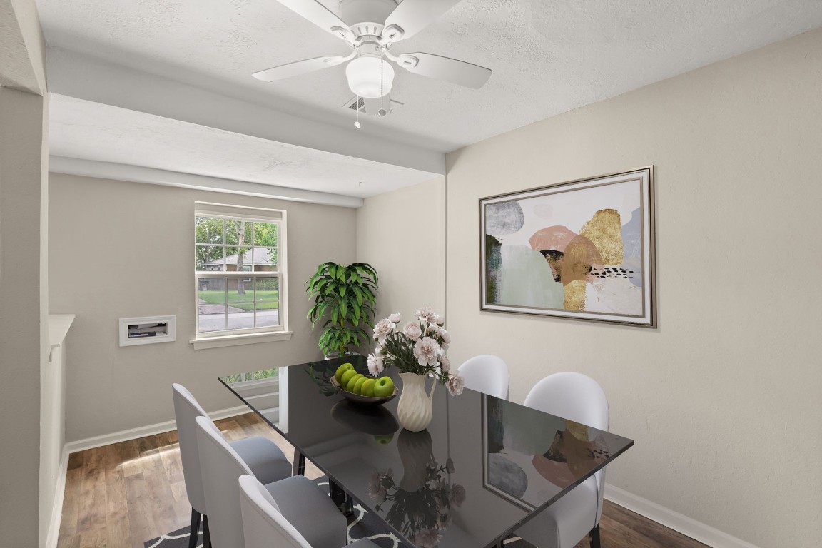 3031 Friar Point Road Houston, TX 77051 - Photo 4 of 15 You and your guests will certainly dine in style in this amazing formal dining room! Featuring a large window with blinds, neutral paint, high ceilings, white stained ceiling fan with lighting and laminate flooring. Perfect space to entertain family and friends. *Virtually Staged*
