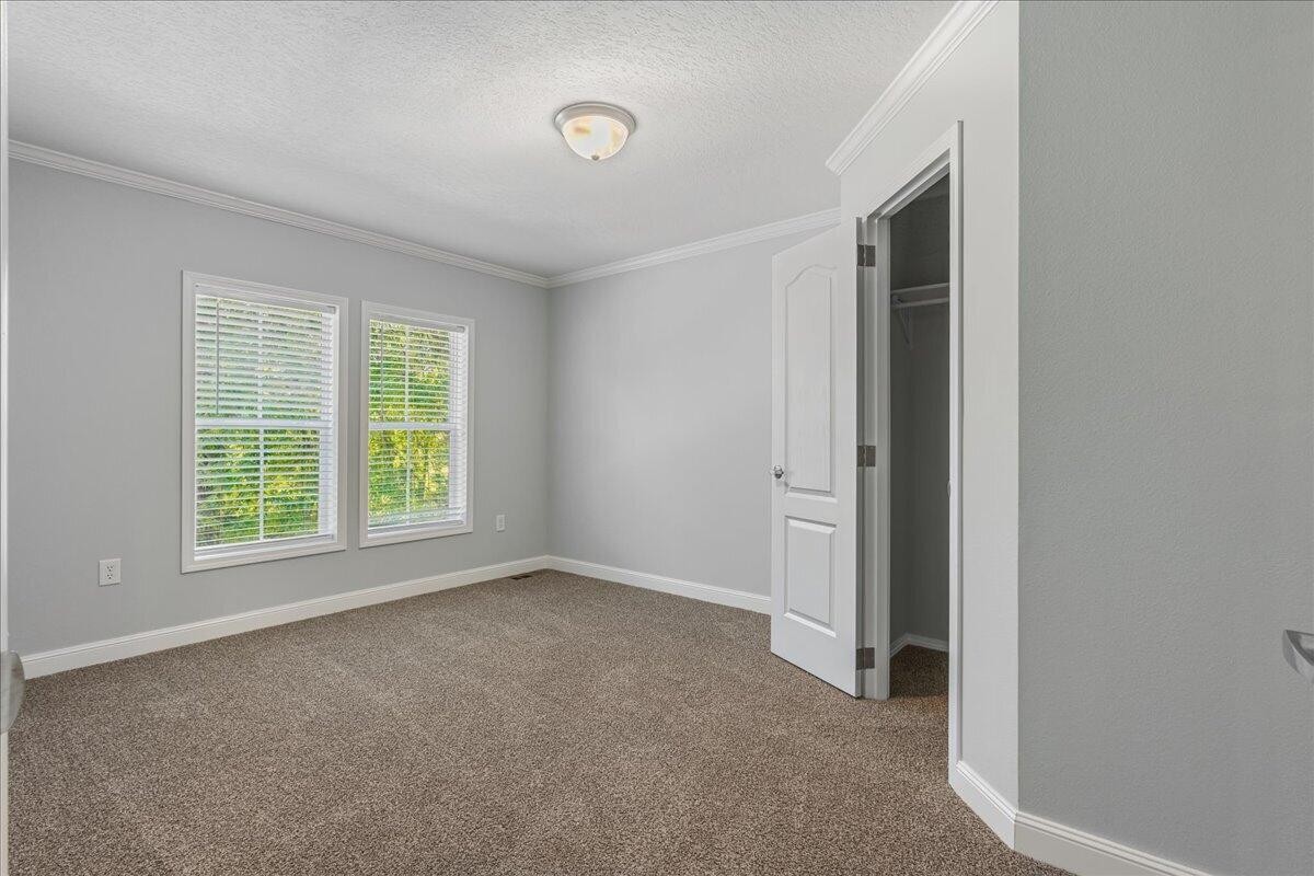 1629 Wasson Road Ten Mile, TN 37880 - Photo 23 of 27 an empty room with windows and closet