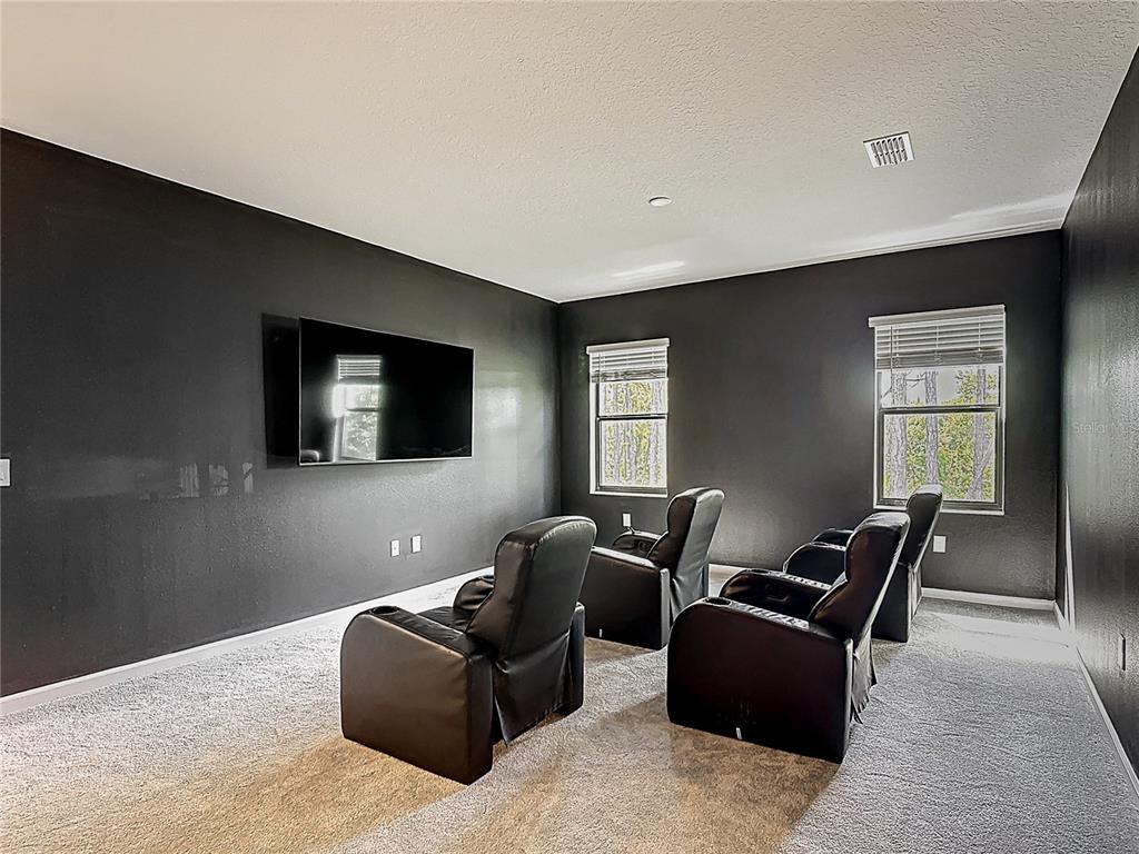 1326 Butterfly Orchid Road Davenport, FL 33837 - Photo 29 of 54 a living room with furniture and a window