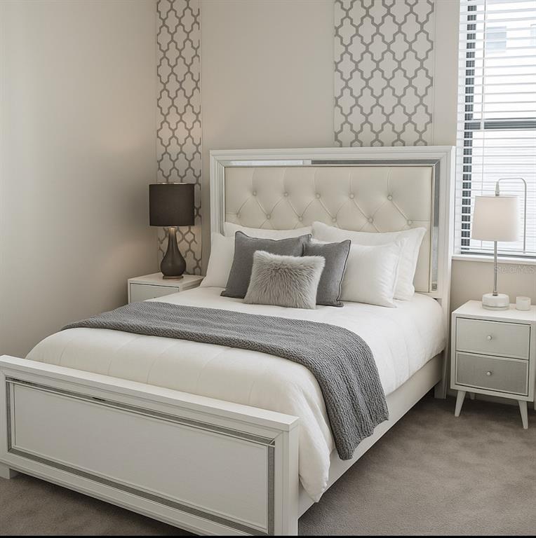 1326 Butterfly Orchid Road Davenport, FL 33837 - Photo 42 of 54 a bedroom with a bed and a night stand