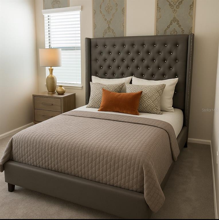 1326 Butterfly Orchid Road Davenport, FL 33837 - Photo 46 of 54 a large bed sitting in a bedroom next to a window