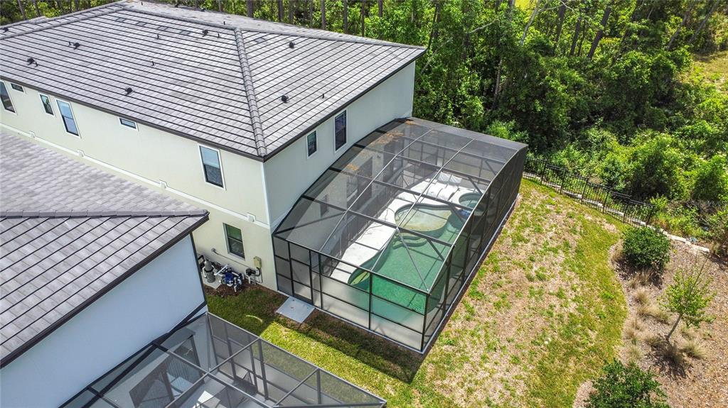 1326 Butterfly Orchid Road Davenport, FL 33837 - Photo 5 of 54 a aerial view of a house with a yard and furniture