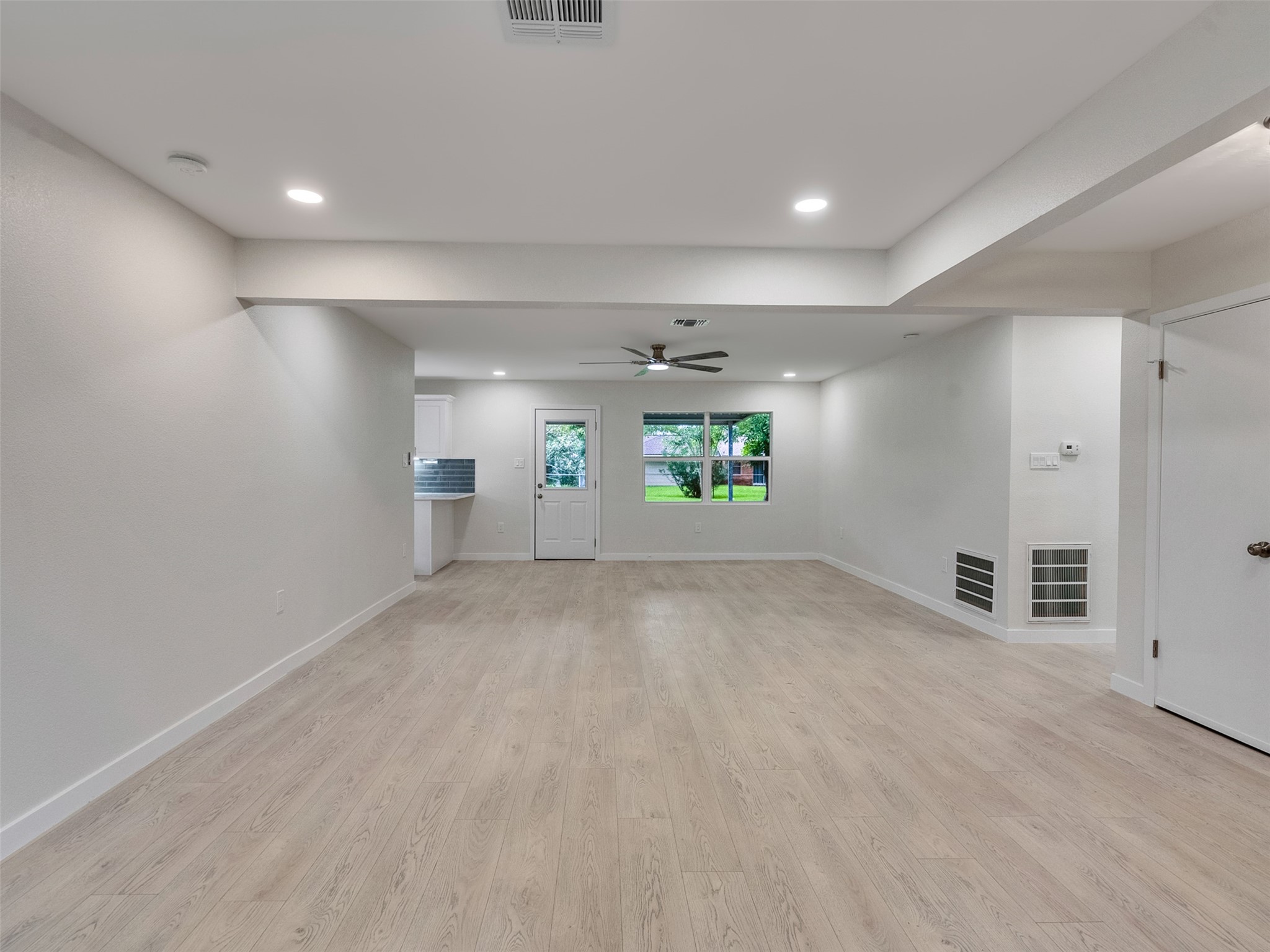 10315 Winding Trail Road La Porte, TX 77571 - Photo 4 of 24 This spacious living and dining combo boasts an open, airy layout with sleek flooring and abundant natural light, perfect for seamless entertaining and relaxed living.