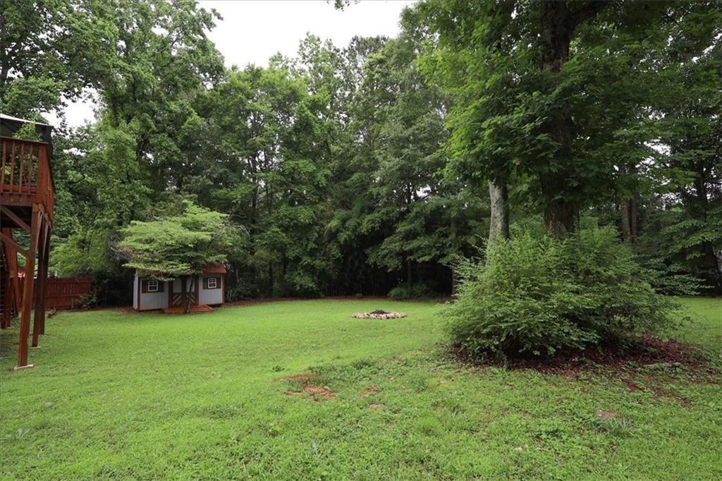 236 Hiram Sudie Road Dallas, GA 30157 - Photo 25 of 26 a view of a house with a backyard