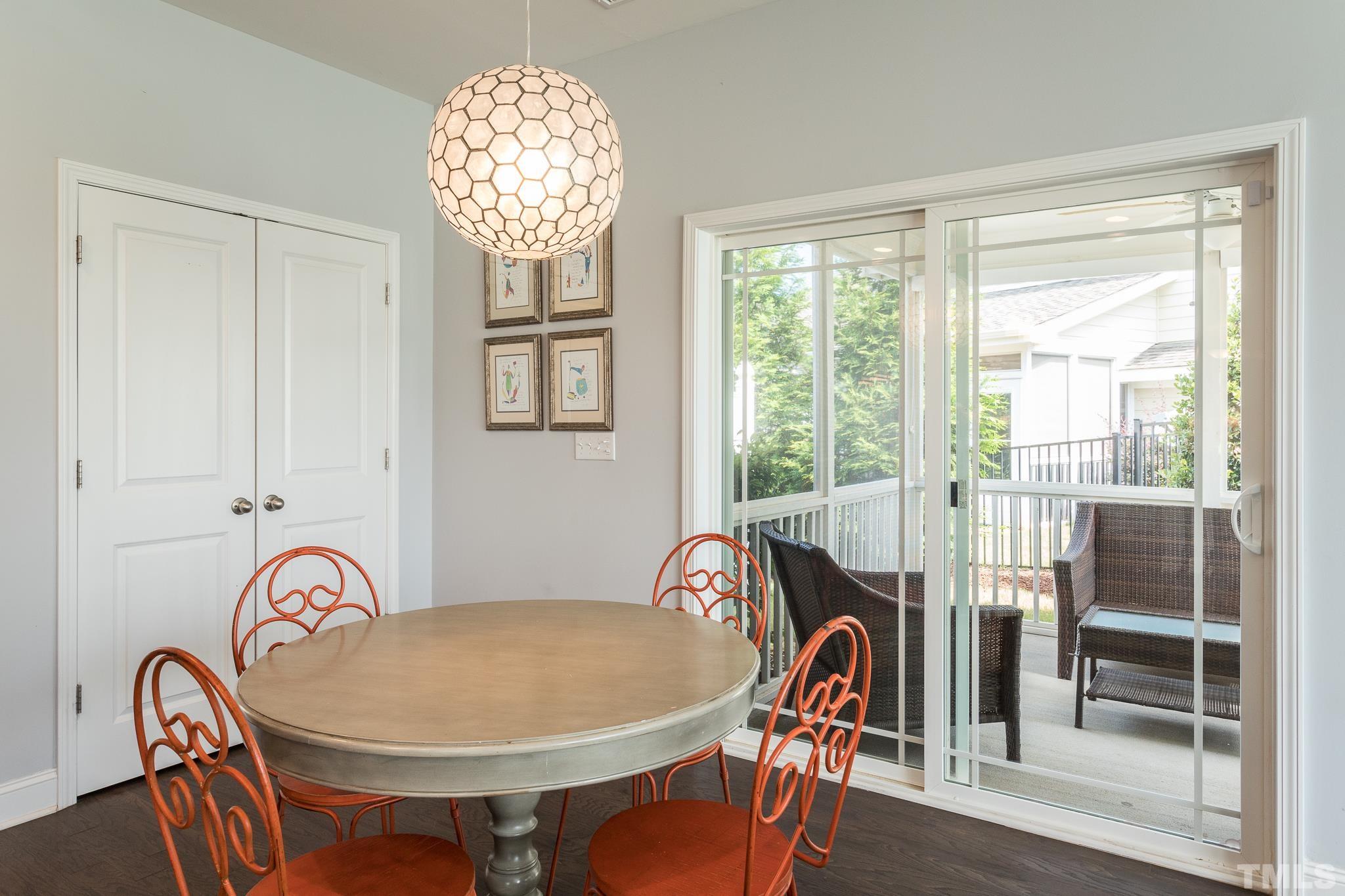 114 Willow View Lane Apex, NC 27539 - Photo 15 of 40 a view of a dining room with furniture wooden floor and chandelier