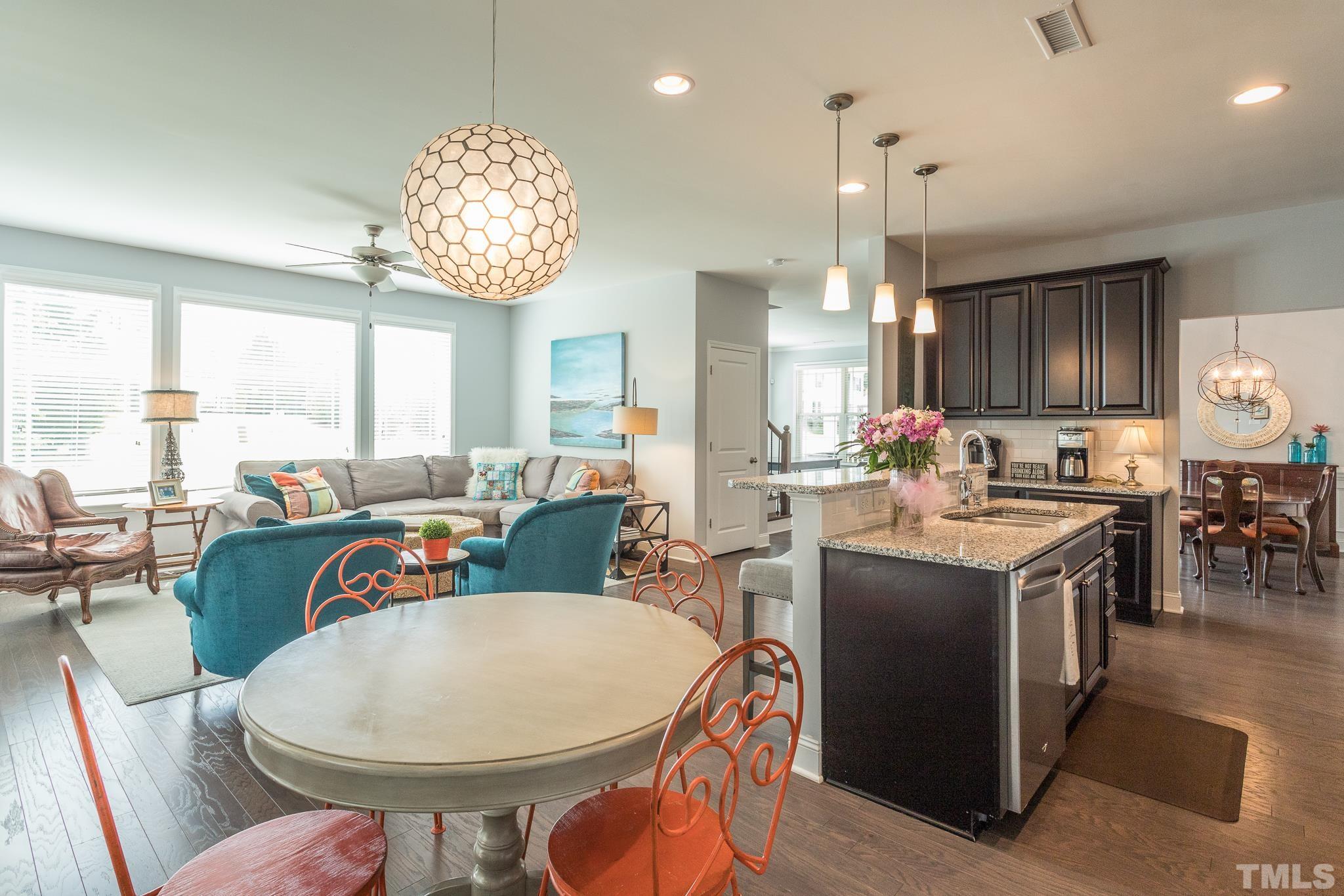 114 Willow View Lane Apex, NC 27539 - Photo 16 of 40 a very nice looking dining room with furniture a chandelier and wooden floor