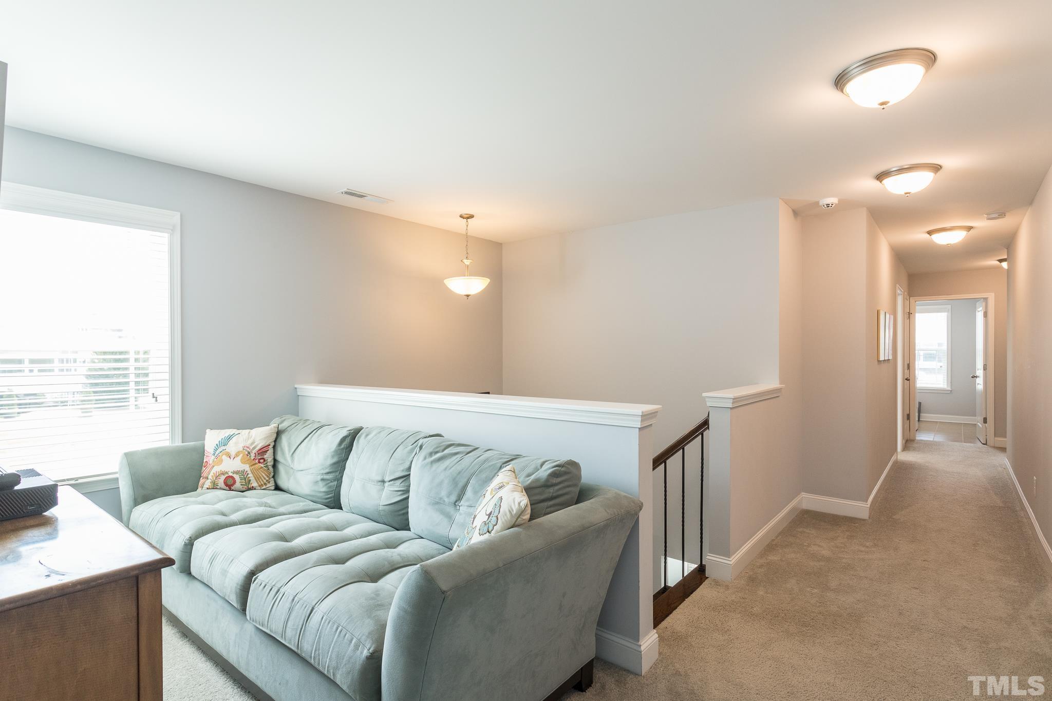 114 Willow View Lane Apex, NC 27539 - Photo 19 of 40 a living room with a couch