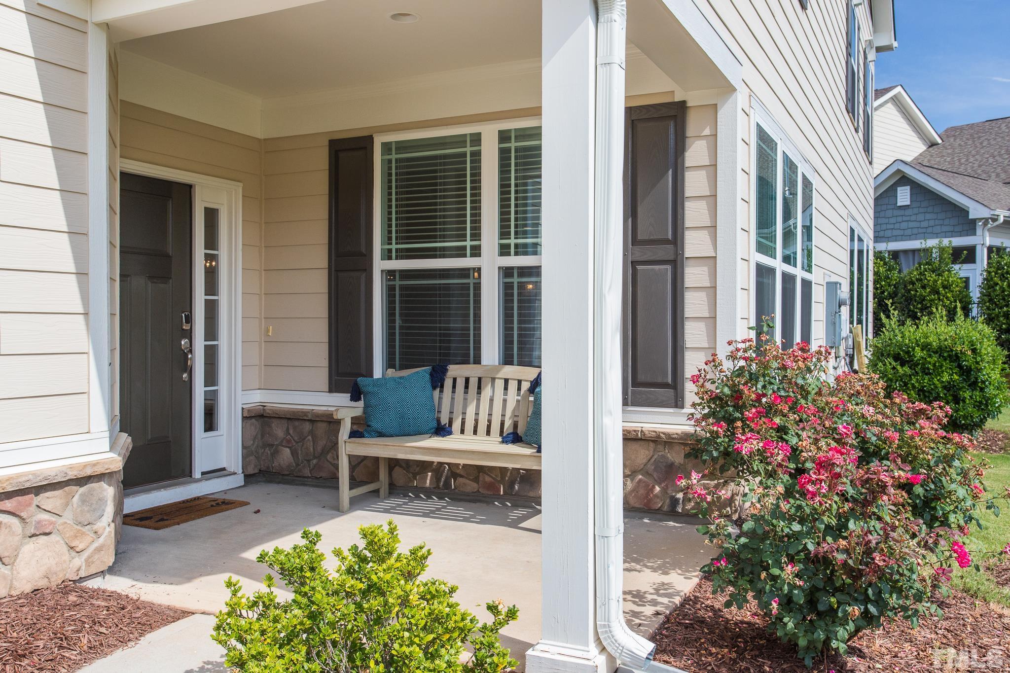 114 Willow View Lane Apex, NC 27539 - Photo 2 of 40 a view of a patio with couches table and chairs and potted plants