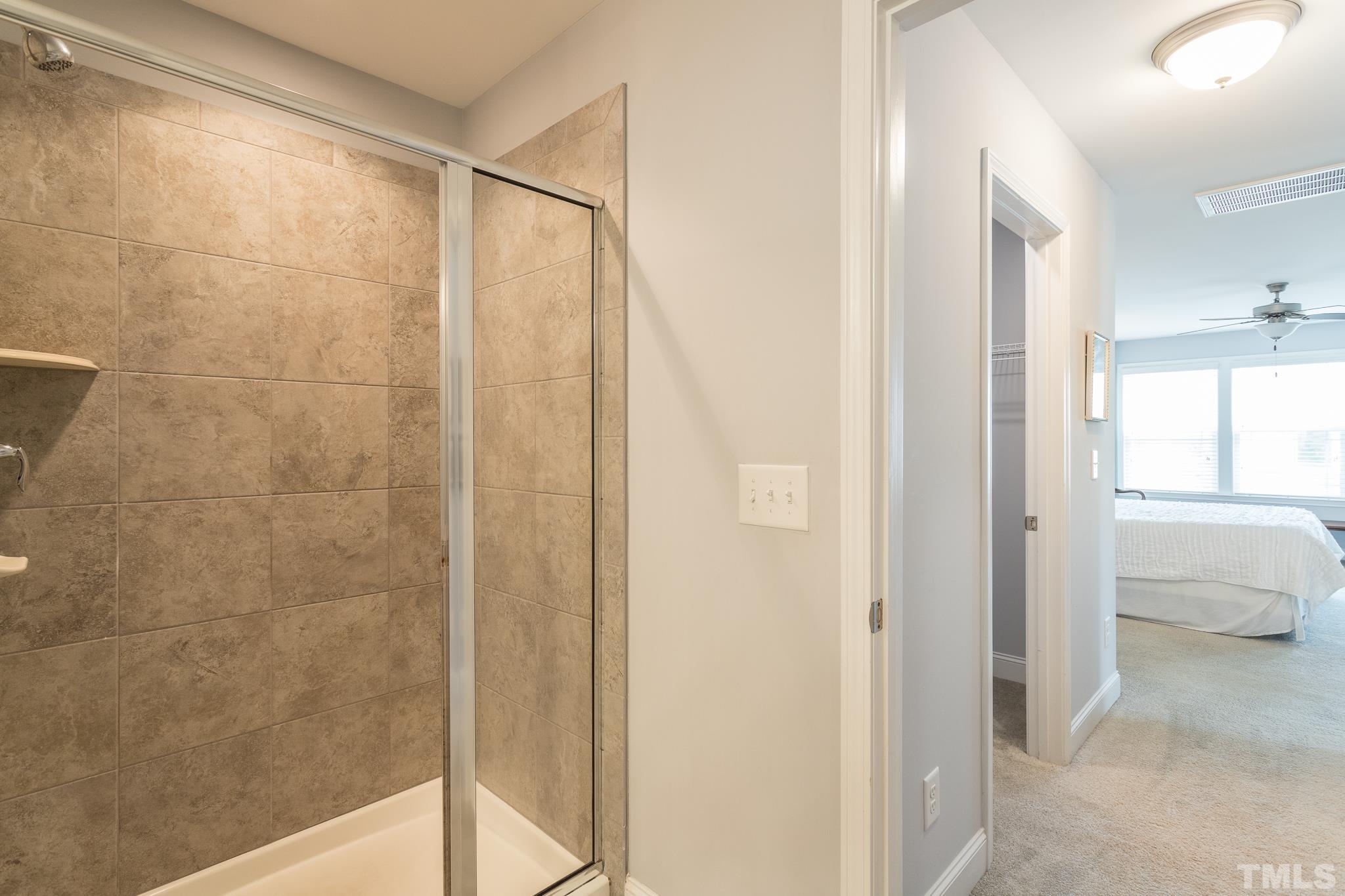 114 Willow View Lane Apex, NC 27539 - Photo 25 of 40 a bathroom with a shower and a tub