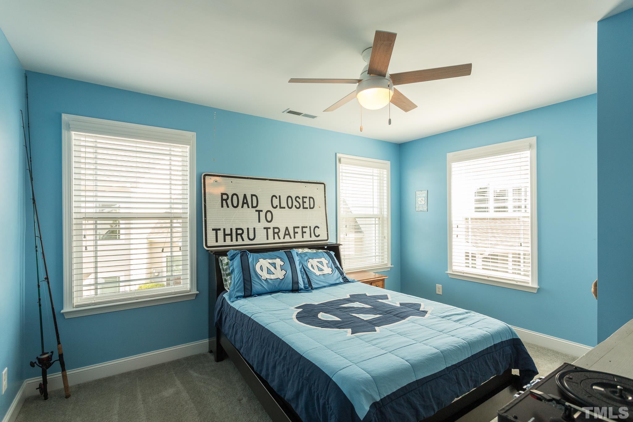 114 Willow View Lane Apex, NC 27539 - Photo 26 of 40 a bedroom with a bed and a window