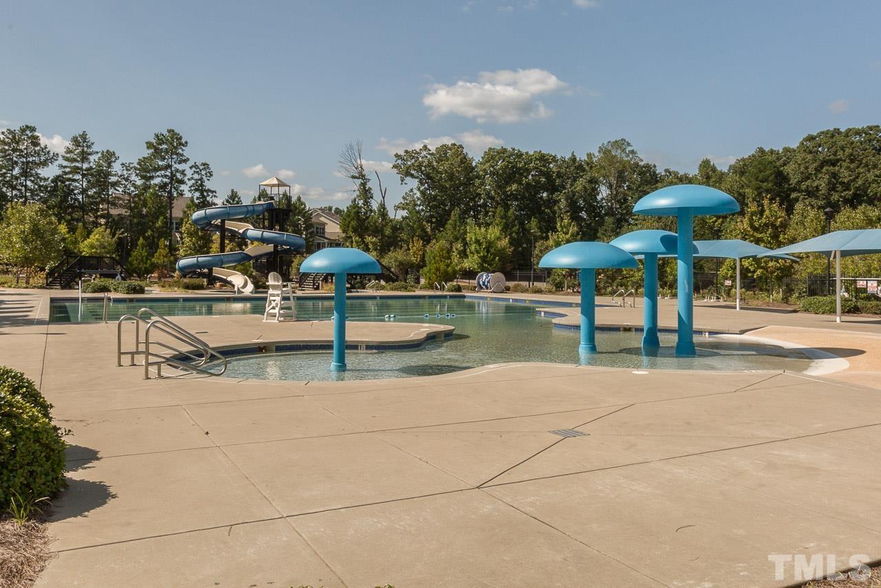 114 Willow View Lane Apex, NC 27539 - Photo 35 of 40 a view of a patio with swimming pool