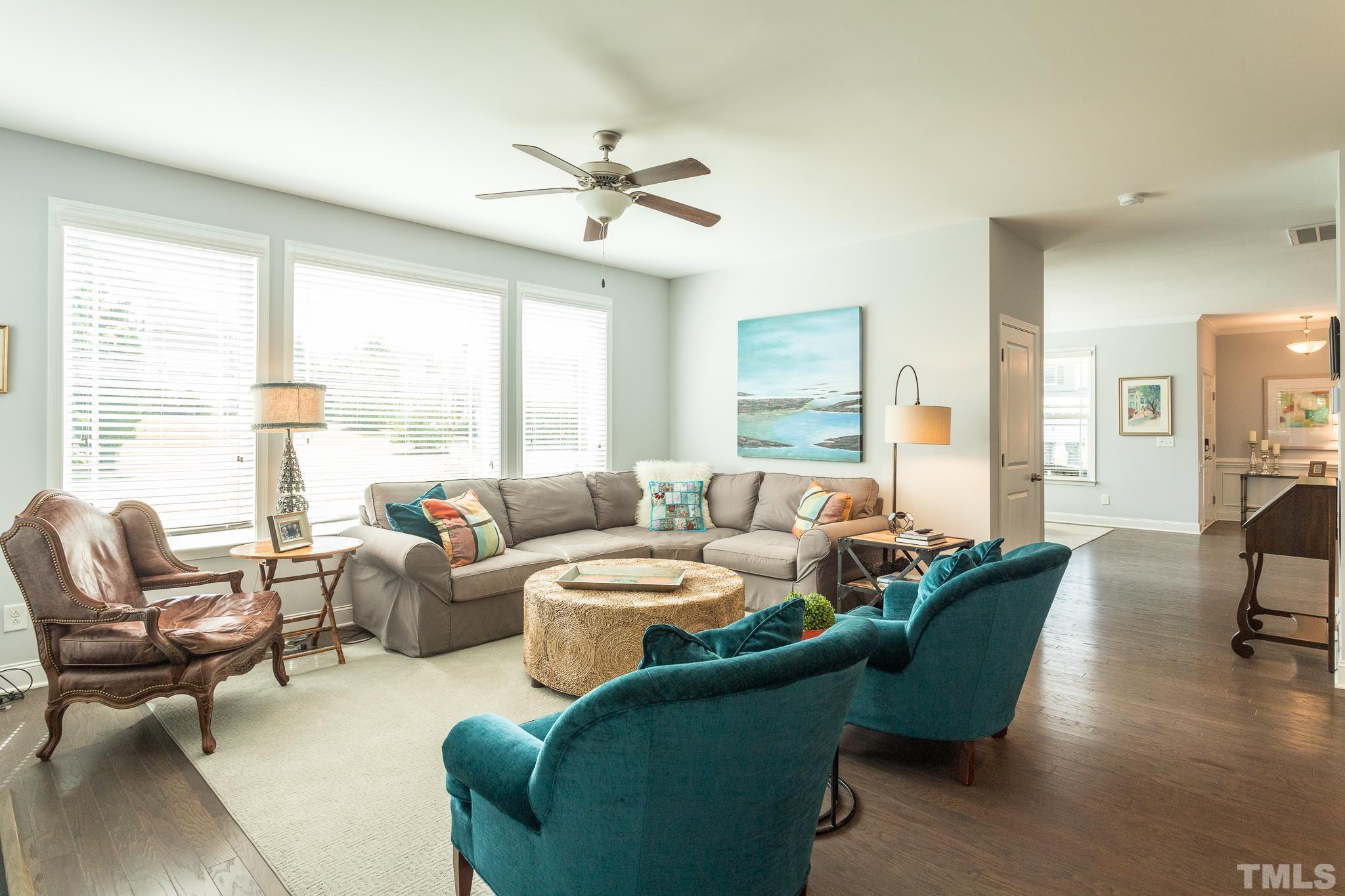114 Willow View Lane Apex, NC 27539 - Photo 9 of 40 a living room with furniture and a large window