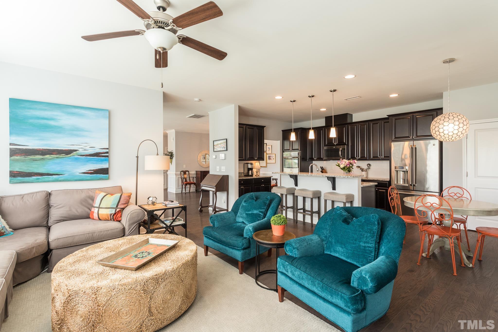 114 Willow View Lane Apex, NC 27539 - Photo 10 of 40 a living room with furniture kitchen view and a large window