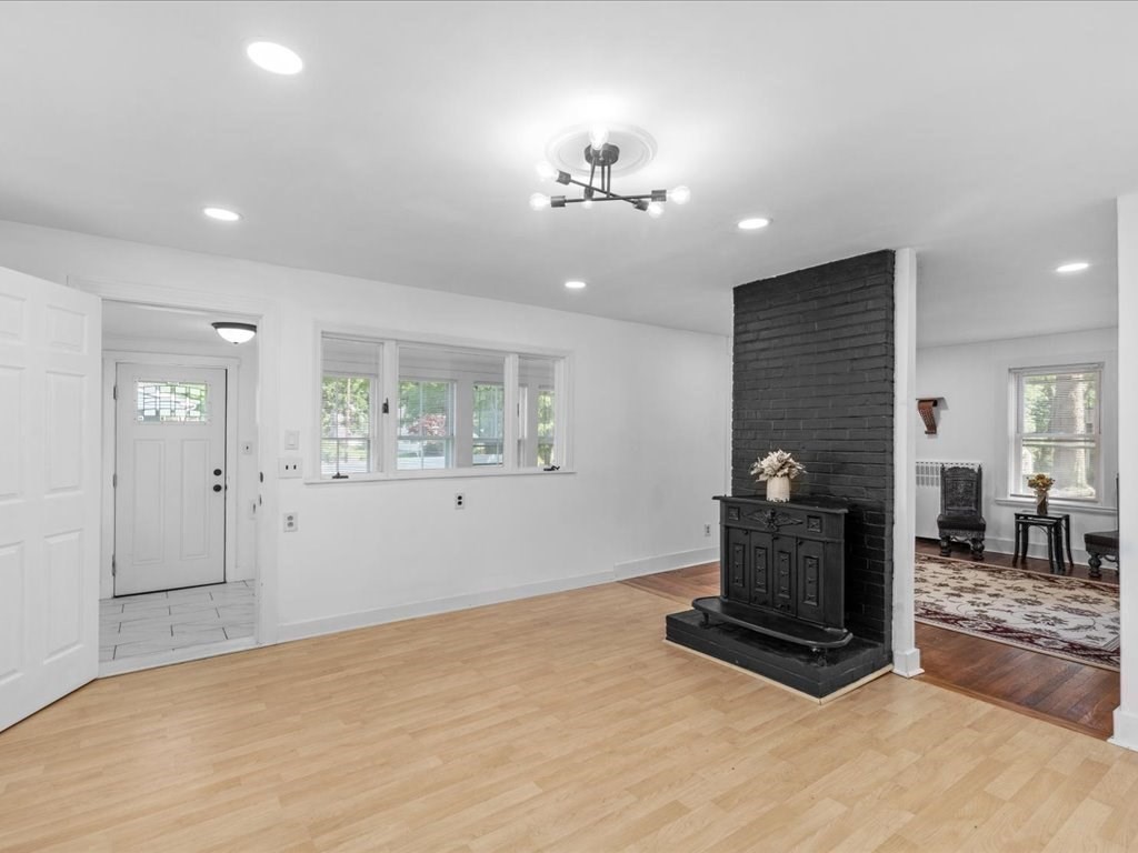21 Ellis Street Framingham, MA 01701 - Photo 11 of 40 a room with hard wood floors and a fireplace