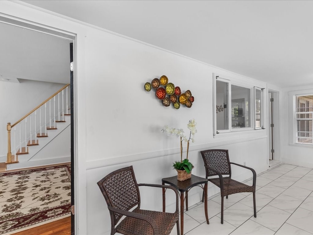 21 Ellis Street Framingham, MA 01701 - Photo 21 of 40 a view of a livingroom with furniture and lounge chair