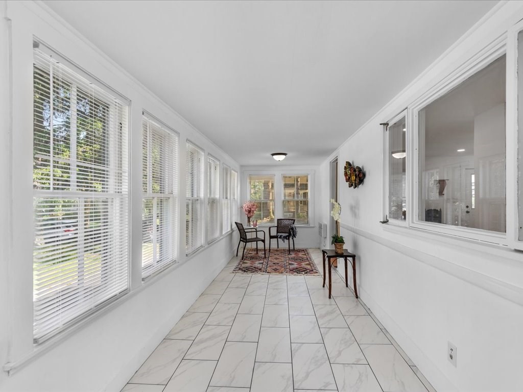 21 Ellis Street Framingham, MA 01701 - Photo 22 of 40 a living room with furniture and large windows