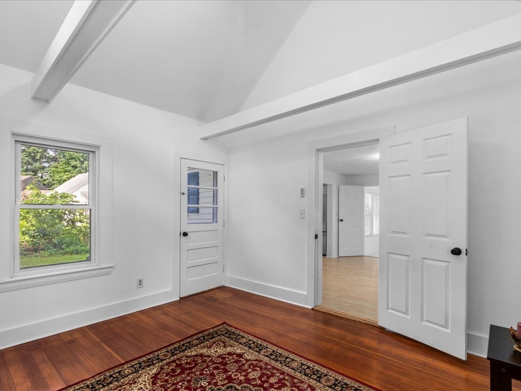 21 Ellis Street Framingham, MA 01701 - Photo 24 of 40 a view of an empty room with window and wooden floor