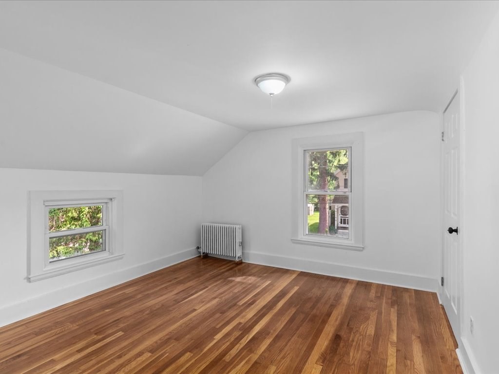 21 Ellis Street Framingham, MA 01701 - Photo 28 of 40 wooden floor in an empty room with a window