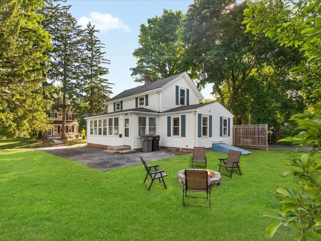 21 Ellis Street Framingham, MA 01701 - Photo 35 of 40 a house that has sitting area in the grass