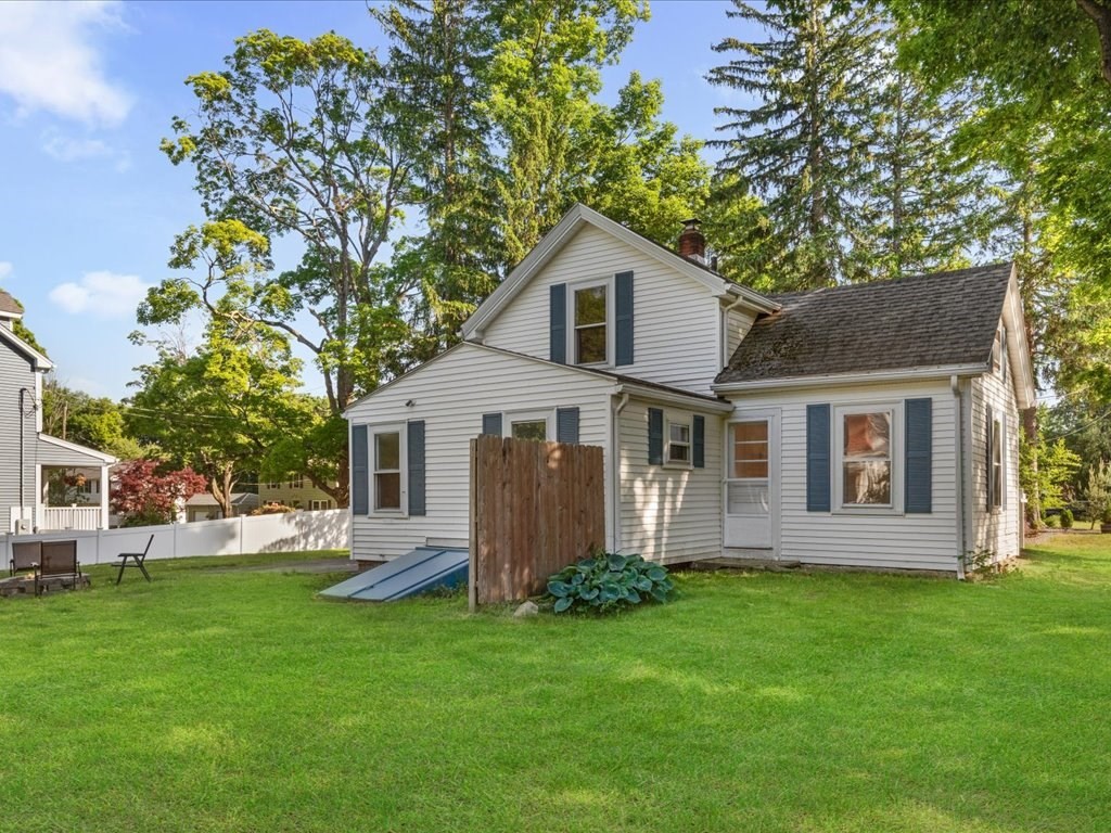 21 Ellis Street Framingham, MA 01701 - Photo 38 of 40 a front view of house with a garden