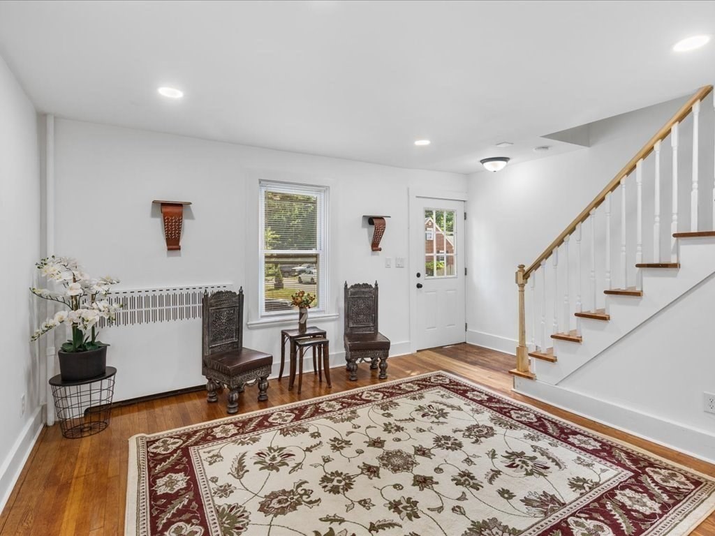21 Ellis Street Framingham, MA 01701 - Photo 7 of 40 a living room with furniture and a rug
