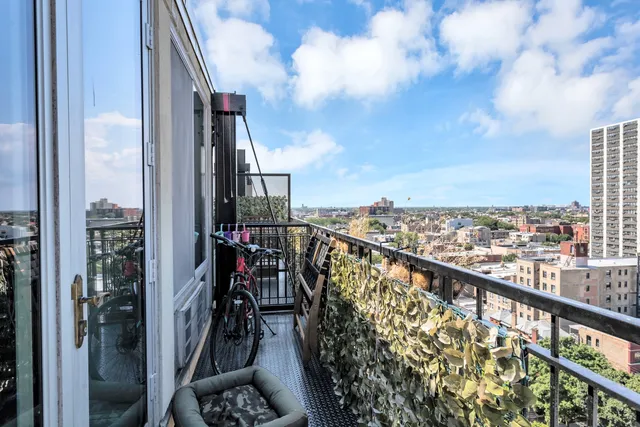 a view of a balcony with city view