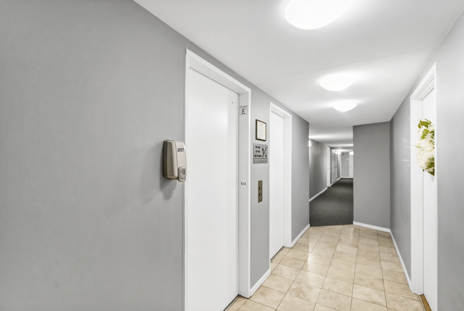 450 West Briar Place, Unit 13G Chicago, IL 60657 - Photo 22 of 34 a view of a hallway with closet and wooden floor