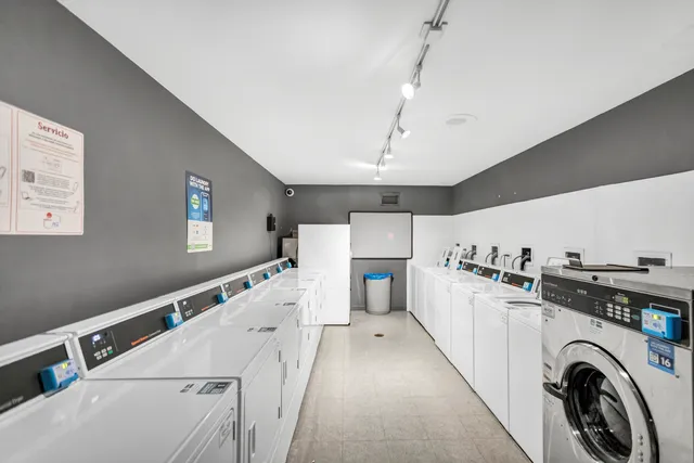 a view of a kitchen with sink and cabinets