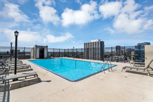 a view of a swimming pool with a terrace